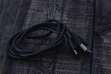 black charger on wooden background