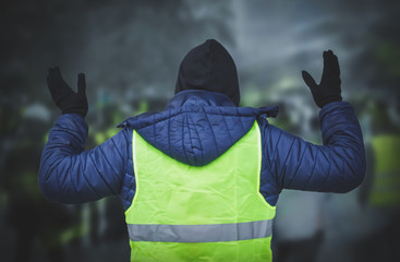 Man in a yellow vest protesting