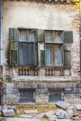 Old wooden windows in a building on  street of Belgrade. Serbia