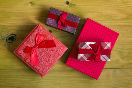 Image of gifts on wooden table.