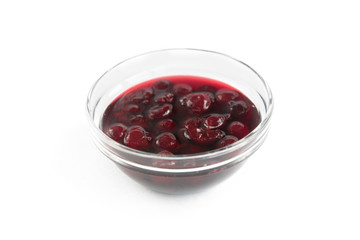 Cherry jam in bowl isolated on white background.