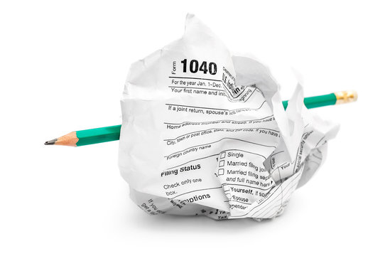 Crumpled Tax Form With Pencil On White.