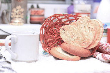 close up.Cup of tea and pastries for Breakfast on blurred backgr