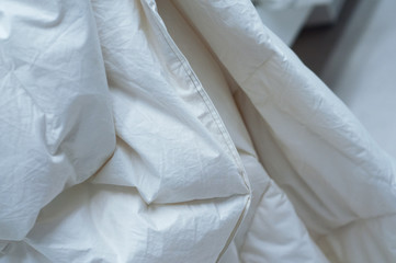 closeup of white set of bed linen in decoration store