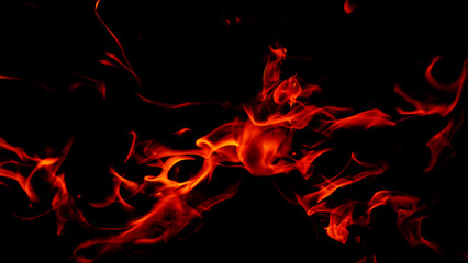 Fototapeta na wymiar Fire flames on Abstract black background, Burning red hot sparks rise from large fire in, Fiery orange glowing