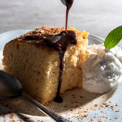 Vanilla cake with chocolate fudge and ice cream