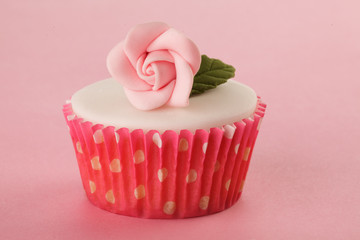 PINK FLOWER CUPCAKE  CLOSE UP FOOD IMAGE