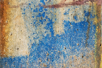 Color bright texture of the destroyed concrete with the appearing rust and blue color in grunge