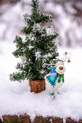 christmas holiday decorations a Christmas tree outside winter snow 