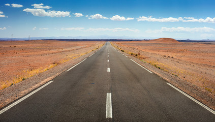 alone asphalt road  in desert in Morocco