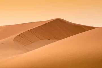Papier Peint photo Sécheresse beau coucher de soleil orange au-dessus du désert au Maroc