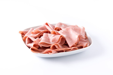 Mortadella slices on white plate isolated on white background