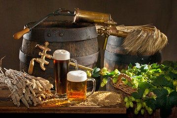 Still life with beer glasses and raw material for beer production