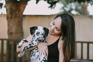 young girl and a dalmatian dog with heterochromia	