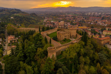 Sunset aerial panorama of Cesena in Emilia Romagna Italy near Forli and Rimini, with the medieval Malatestiana castle, Piazza del Popolo and Roman Catholic churches and cathedral on a winter afternoon