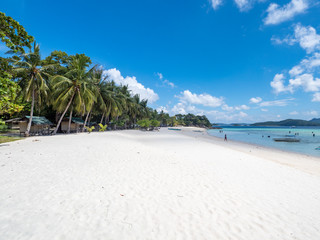 Tropical beach on the island Malcapuya, Philippines. Beautiful island with white sand and palm trees. November, 2018