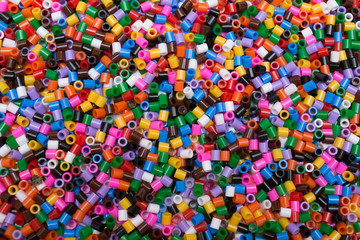 Fototapeta na wymiar A lot of plastic toy beads