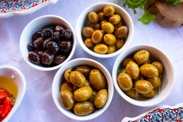 Olives on breakfast table.