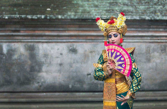 balinese legong dancer in traditional outfit and full make up 