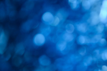 Bokeh photo. Holiday background. Christmas lights. background. Defocused sparkles. New Year...