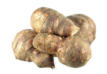 Composition of several Jerusalem artichoke or Sunroot tubers isolated on white background