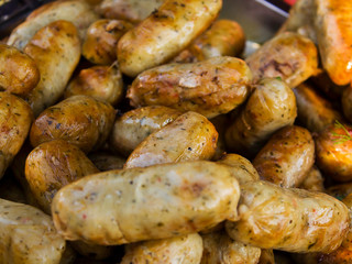 Fried whole sausages. Lie in large quantities in a bowl.