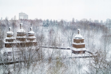 Ukrainian snow-covered church in the park in winter