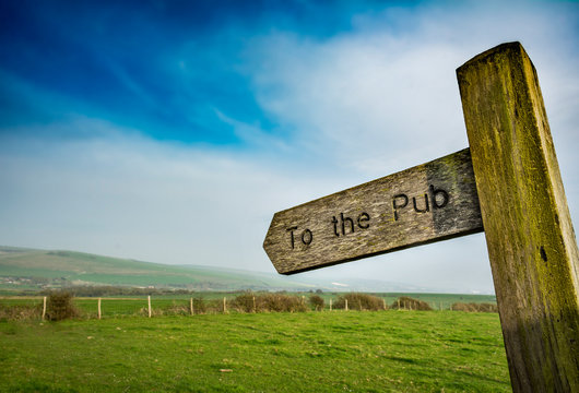 To the pub sign in rural setting