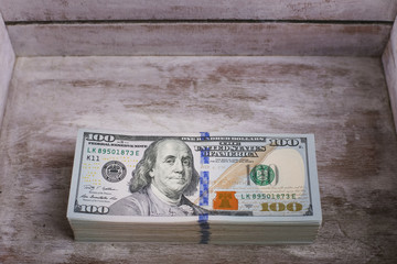 American dollars in one hundred banknotes. Lot of dollars close up