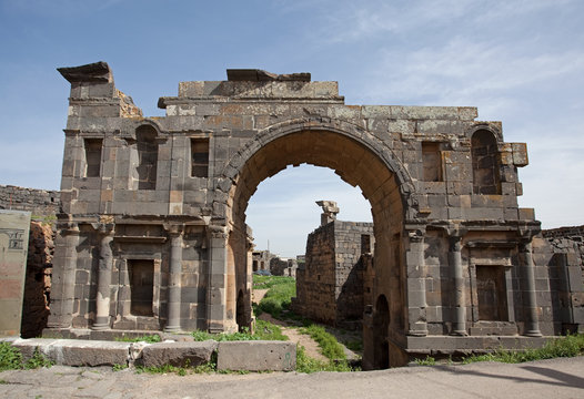 The entry arch of the ancient city of Busra (Bosra). Syria