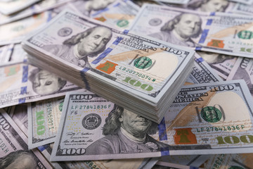 American dollars in one hundred banknotes. Lot of dollars close up