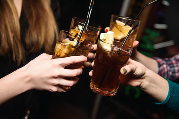 glass of coctail in hand