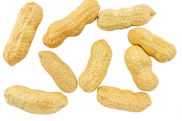 unpeeled peanuts on white background