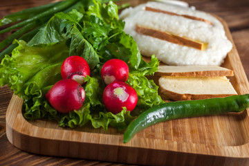 Mengrelian corn mamalica (ghomi) with cheese and various herb on wooden table. Georgian traditional food