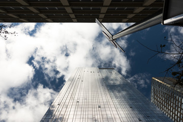 Skyscraper facade with the sky and clouds reflected on the windows. Manhattan, New York city, Usa.