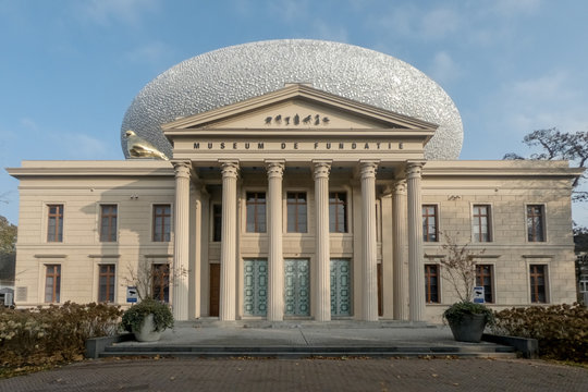 Museum De Fundatie in Zwolle with its Roman style building and unique egg shaped structure on top and part of the building and golden goose on the facade