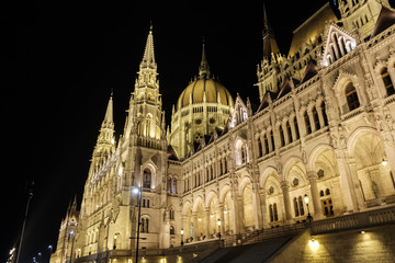 Fototapeta na wymiar Scenic view of Hungarian parliament in ancient historic tourist city Budapest in nightlight illumination in Hungary
