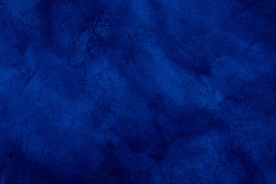 Dark blue marble or cracked concrete background (as an abstract mystical background or marble or concrete texture)