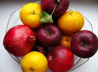 Burgundy apples, tangerines, pomegranate