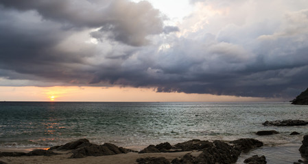 Amazing sunset seen from a beautiful beach in Phuket, Thailand.