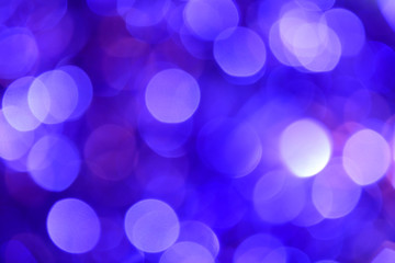 Bokeh. Holiday background. Christmas lights. Glitter. Defocused sparkles. New Year backdrop. Festive wallpaper. Blinks. Carnival. Tinsel. Bokeh retro style photo.