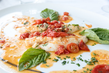 Cod with tomato and basil