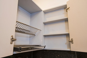 Kitchen interior design cupboard detail with plate rack