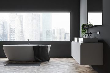 Gray bathroom with tub and sink