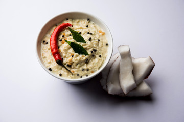 Nariyal or Coconut Chutney served in a bowl. Isolated over moody background. selective focus