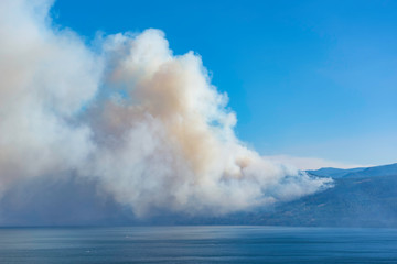 Naklejka na ściany i meble Smoke from a forest fire near Pearchland British Columbia Canada