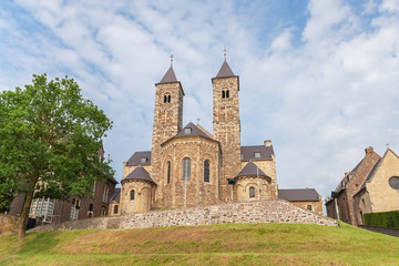Fototapeta na wymiar View of the Romanesque basilica in Sint Odiliënberg village, Limburg, The Netherlands
