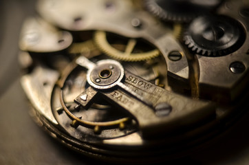 The mechanism of old antique pocket watches, Close up view of old clock's gears. selective focus