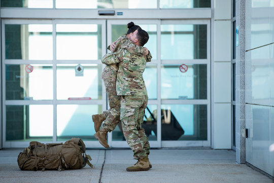 Two soldiers reuniting