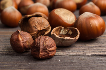 Handful of hazelnuts on wooden background